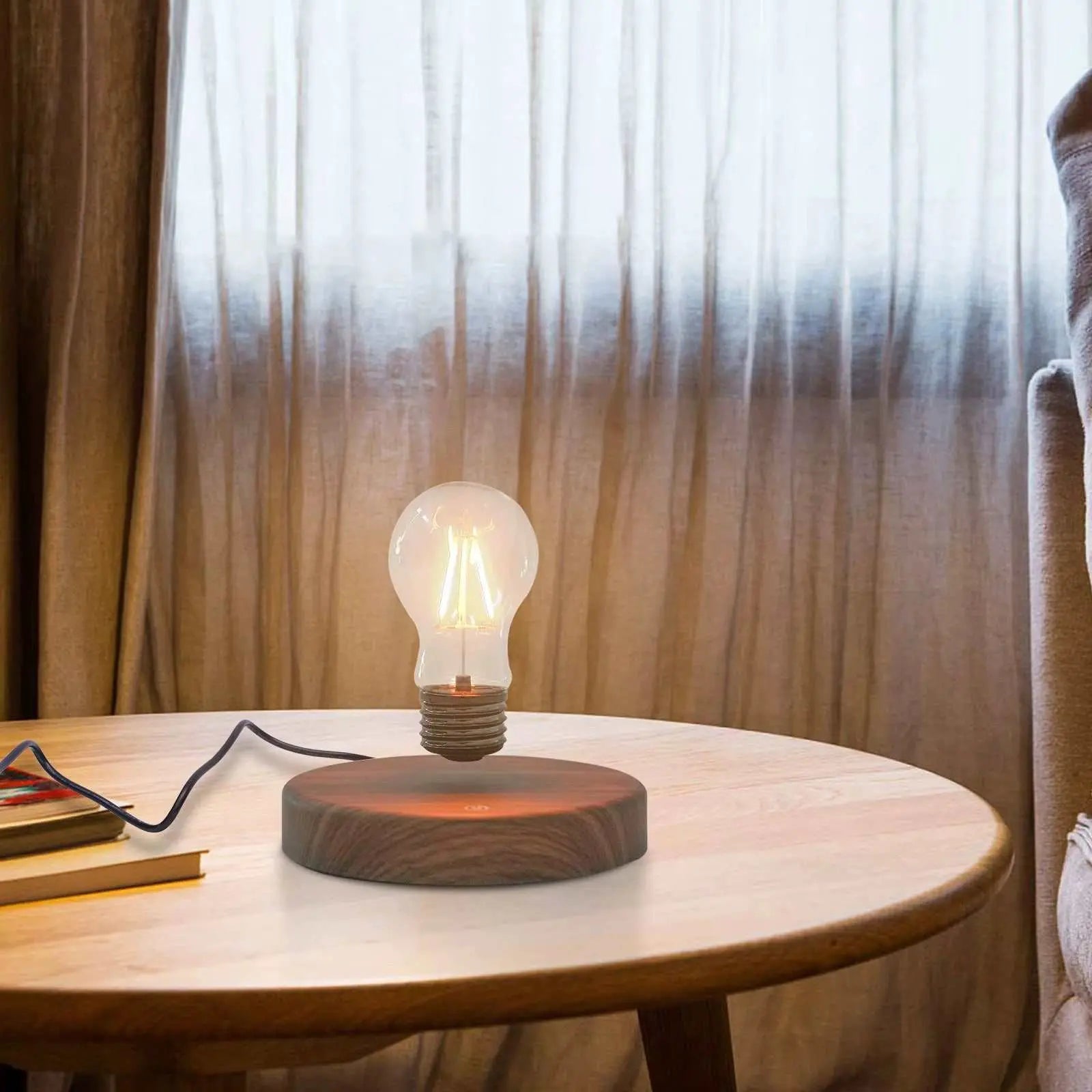 Magnetic levitating light bulb floating and spinning above wooden base on table in living room