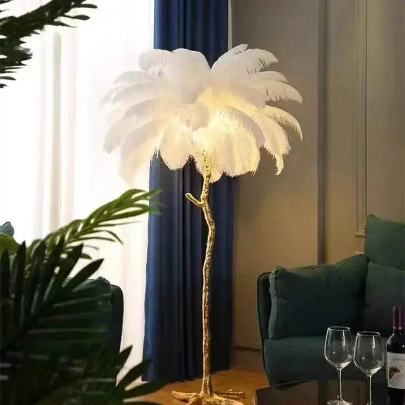Nordic LED floor lamp with white ostrich feather shade and gold-toned resin stand in a living room setting