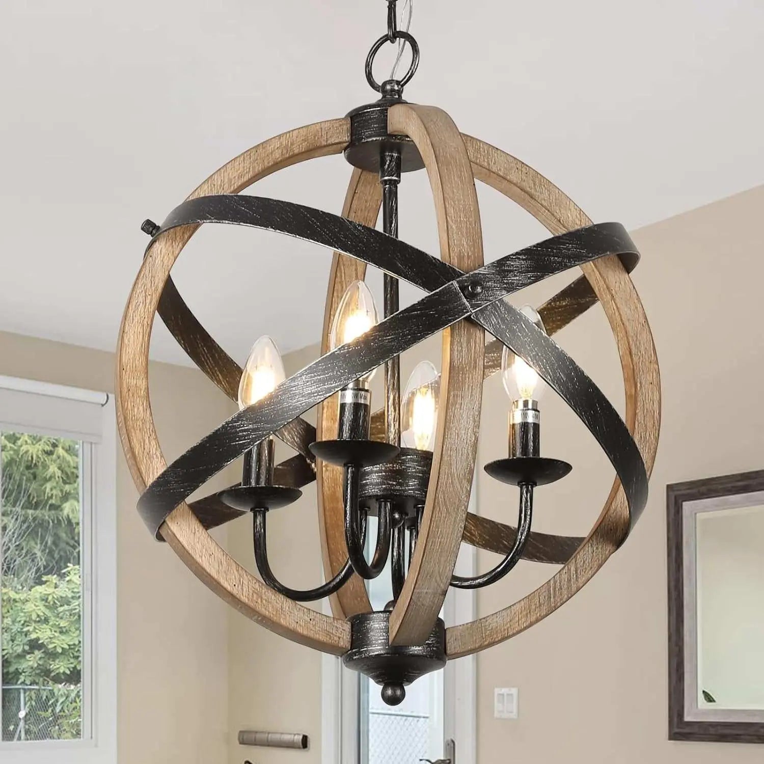 Rustic farmhouse chandelier lamp with adjustable height featuring wood and black metal spherical frame and four candle-style lights