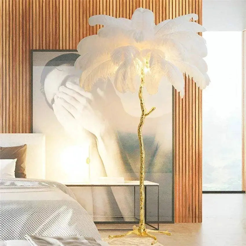 Nordic LED floor lamp with white ostrich feathers and gold resin stand in modern bedroom setting