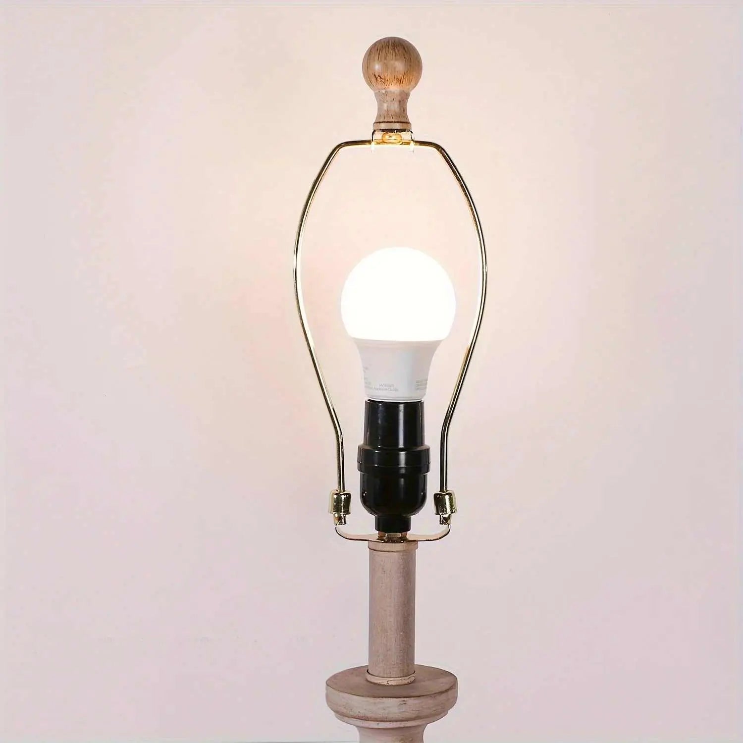 Coastal candlestick table lamp with wooden base and LED bulb on white background