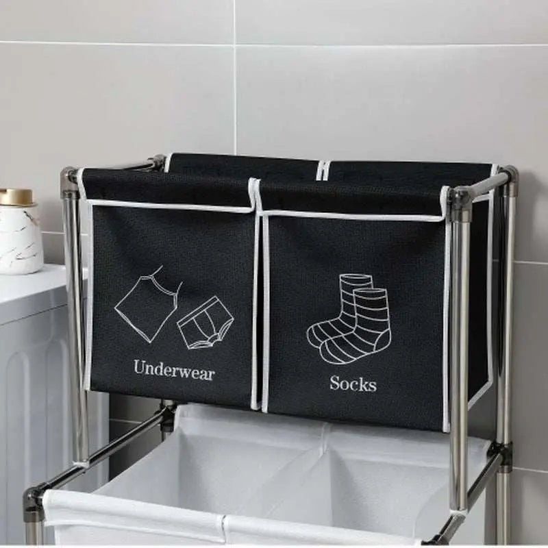 Black and white 2 tier laundry hamper with four removable bags labeled for organizing underwear, socks, lights, and darks