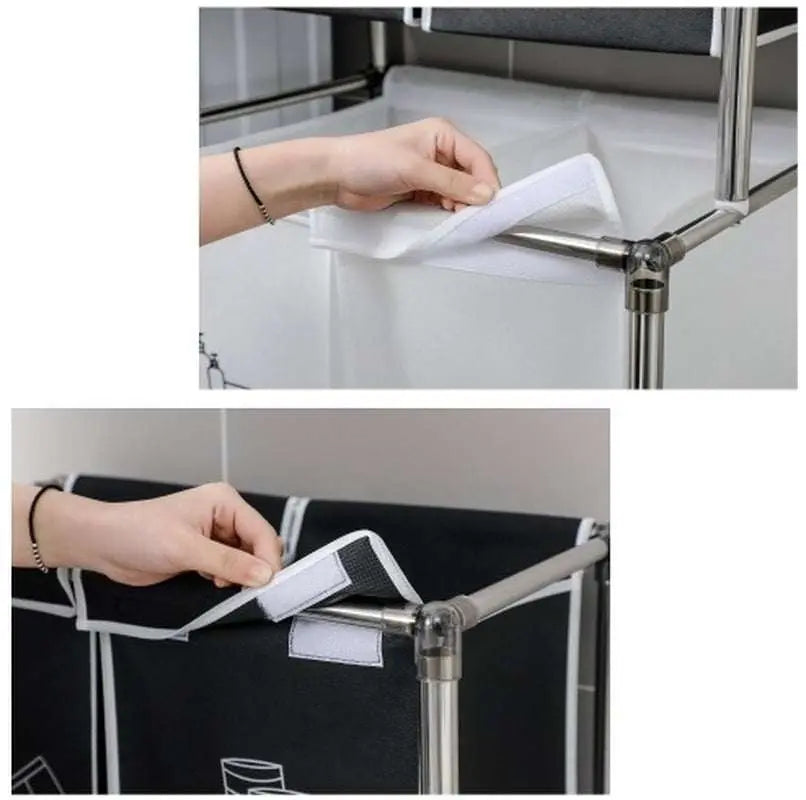 Hands attaching removable fabric bags with Velcro to the metal frame of a black and white Laundry Hamper 2 Tier sorter for organizing clothes.
