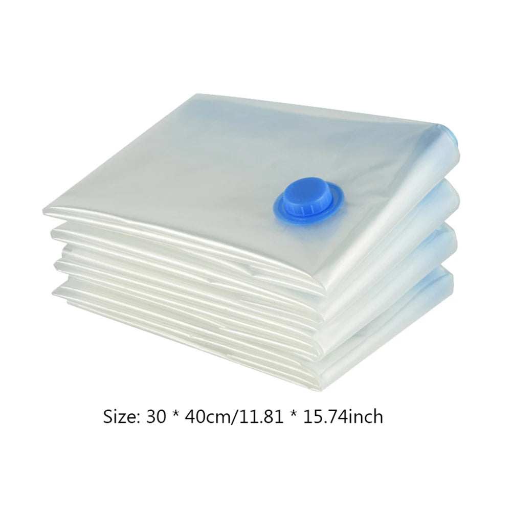 Stack of reusable vacuum compression storage bags with blue valve for space-saving clothes and bedding storage