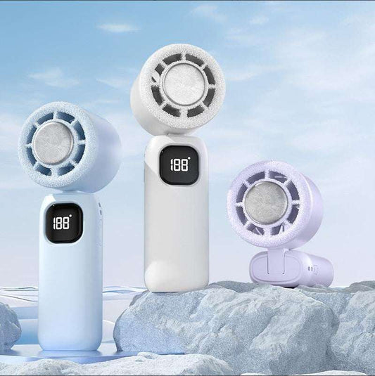 Three mini handheld cooling fans with LED display and foldable design on icy rocks under blue sky