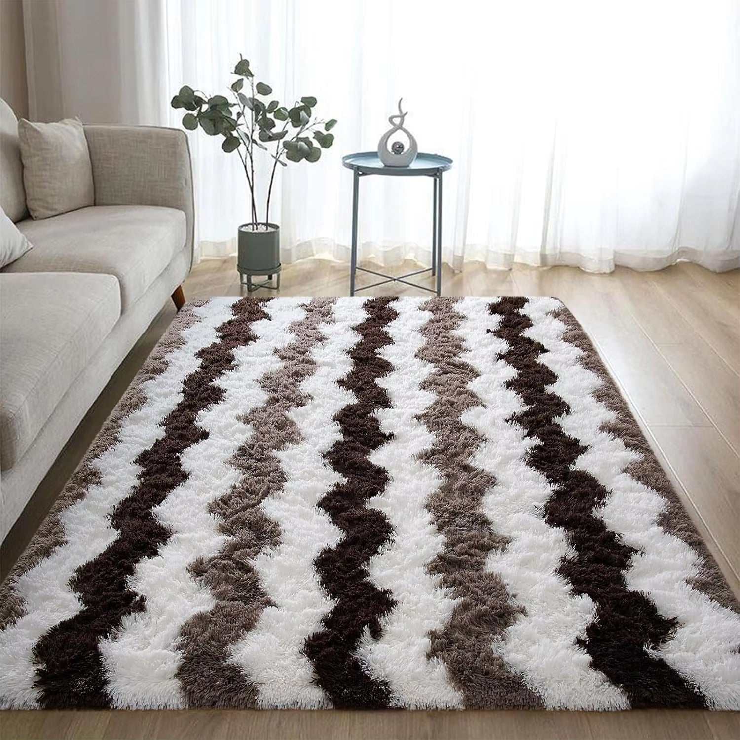 Soft shaggy striped brown plush rug in living room with sofa and small table