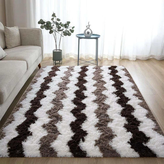 Soft shaggy striped brown plush rug in living room with sofa and small table