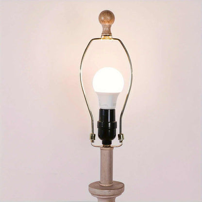 Coastal candlestick table lamp with wooden base and LED bulb on white background