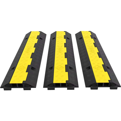 Set of three black and yellow dual-channel cable protector ramps made of rubber and PVC for heavy-duty wire and cord protection with 11,000 lbs load capacity.