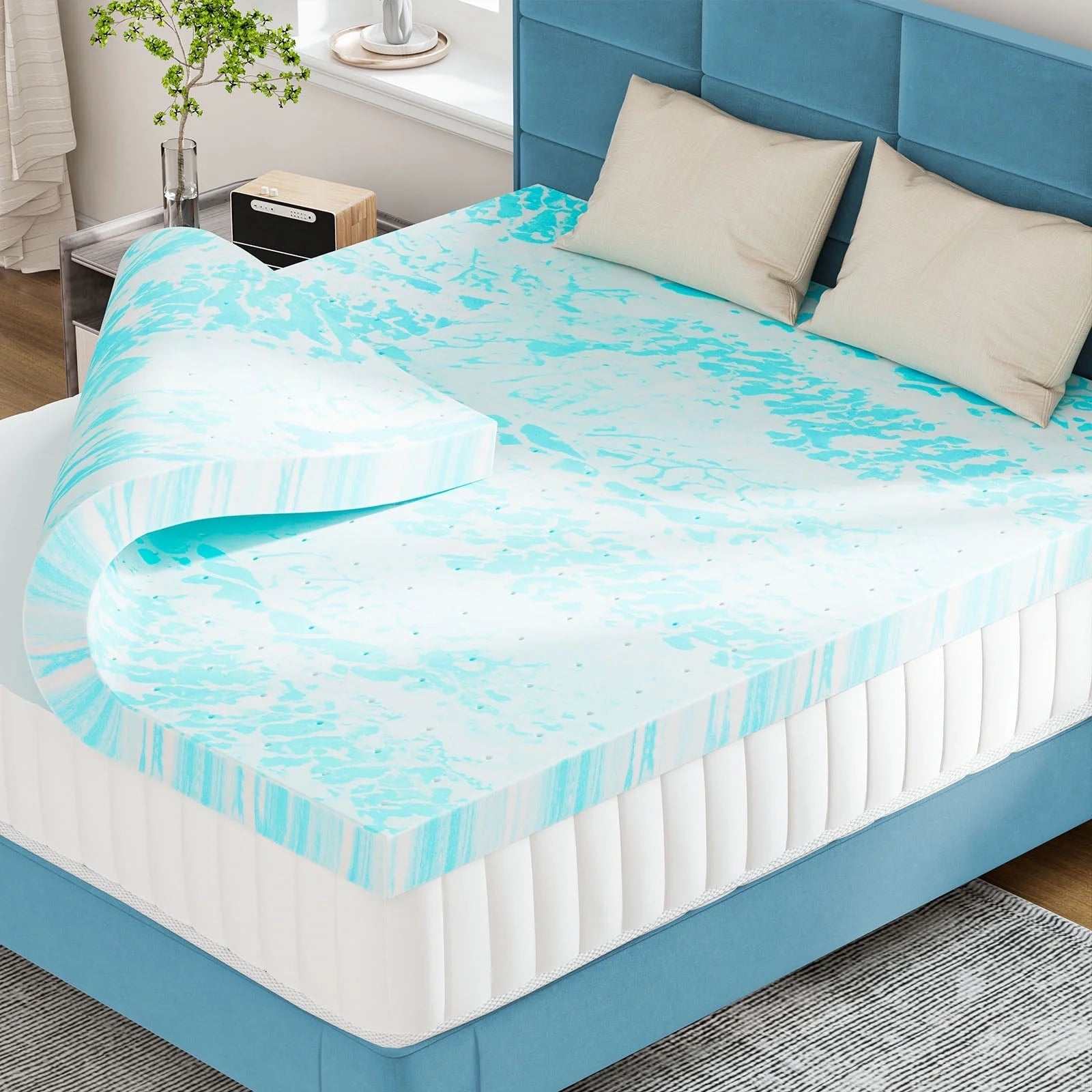 3-inch cooling gel memory foam mattress topper on bed with blue upholstered headboard and beige pillows