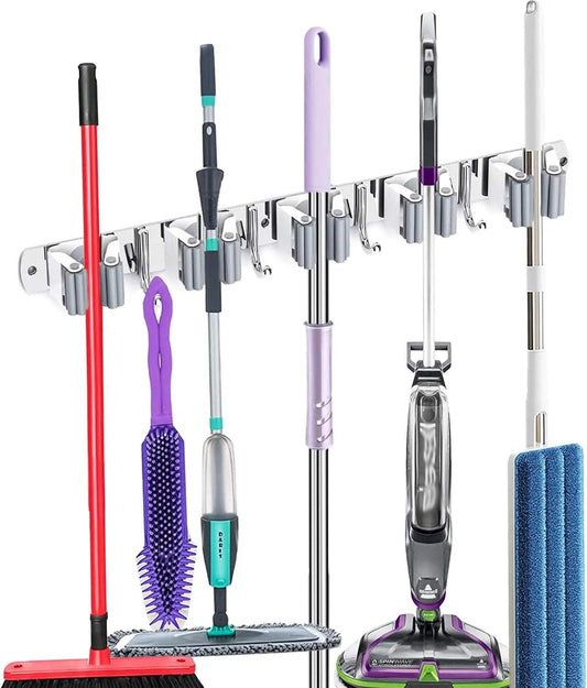 Stainless steel broom holder wall mount with 5 racks and 4 hooks organizing cleaning tools on wall
