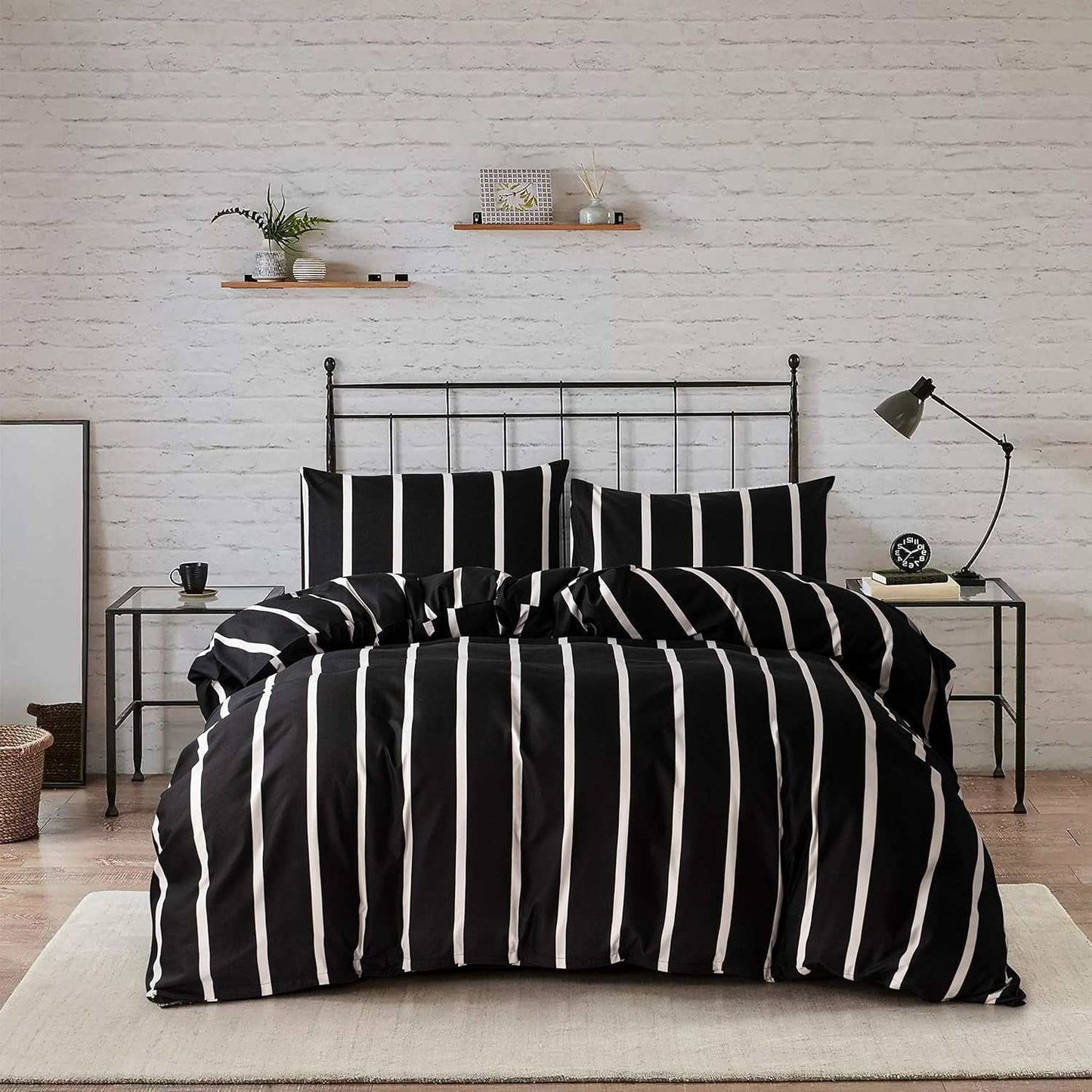 Black and white striped twin comforter set with microfiber fabric on metal bed frame in modern bedroom