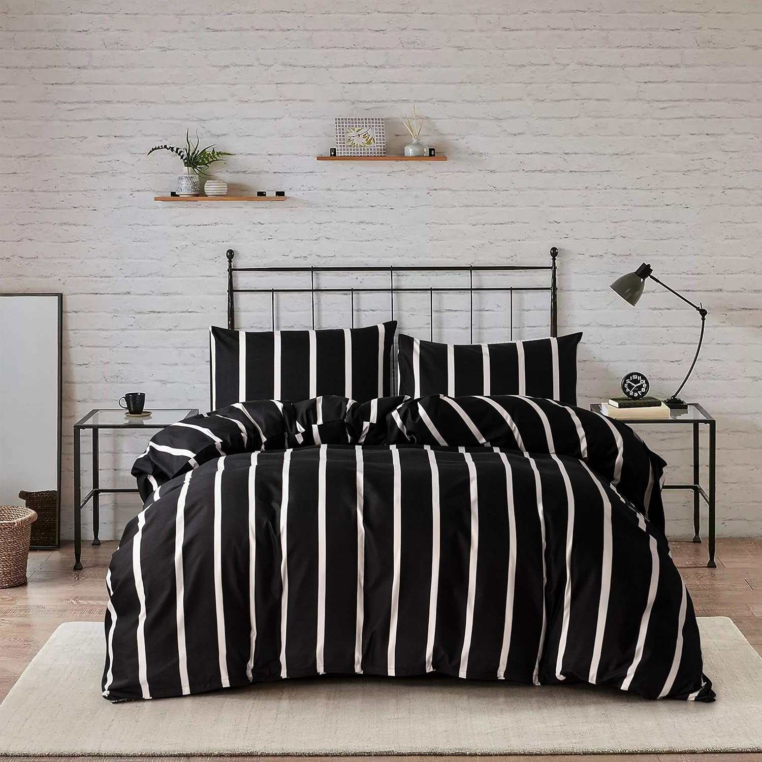 Black and white striped twin comforter set with microfiber fabric on metal bed frame in modern bedroom