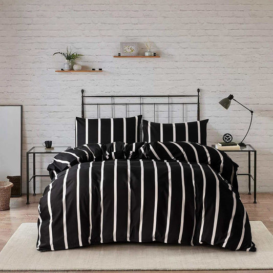 Black and white striped twin comforter set with microfiber fabric on metal bed frame in modern bedroom