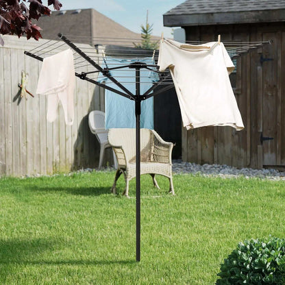 Rotary outdoor umbrella clothes drying rack with clothes hanging on arms in backyard garden